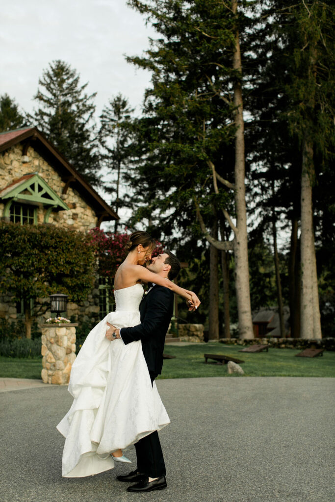 Bride and Groom hug together during golden hour.