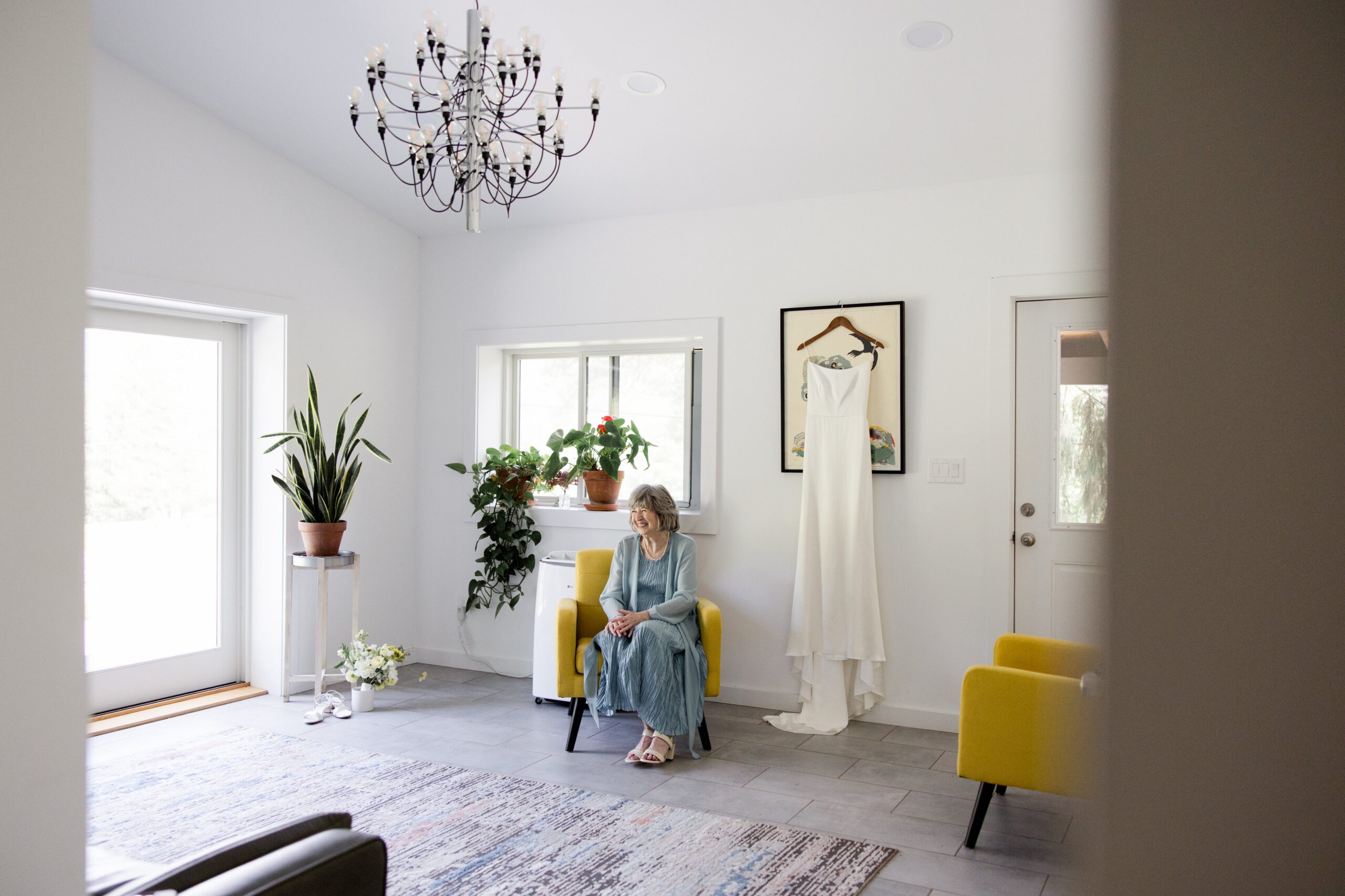 Bride sits in a getting ready suite at her Catskills wedding venue in NY. 