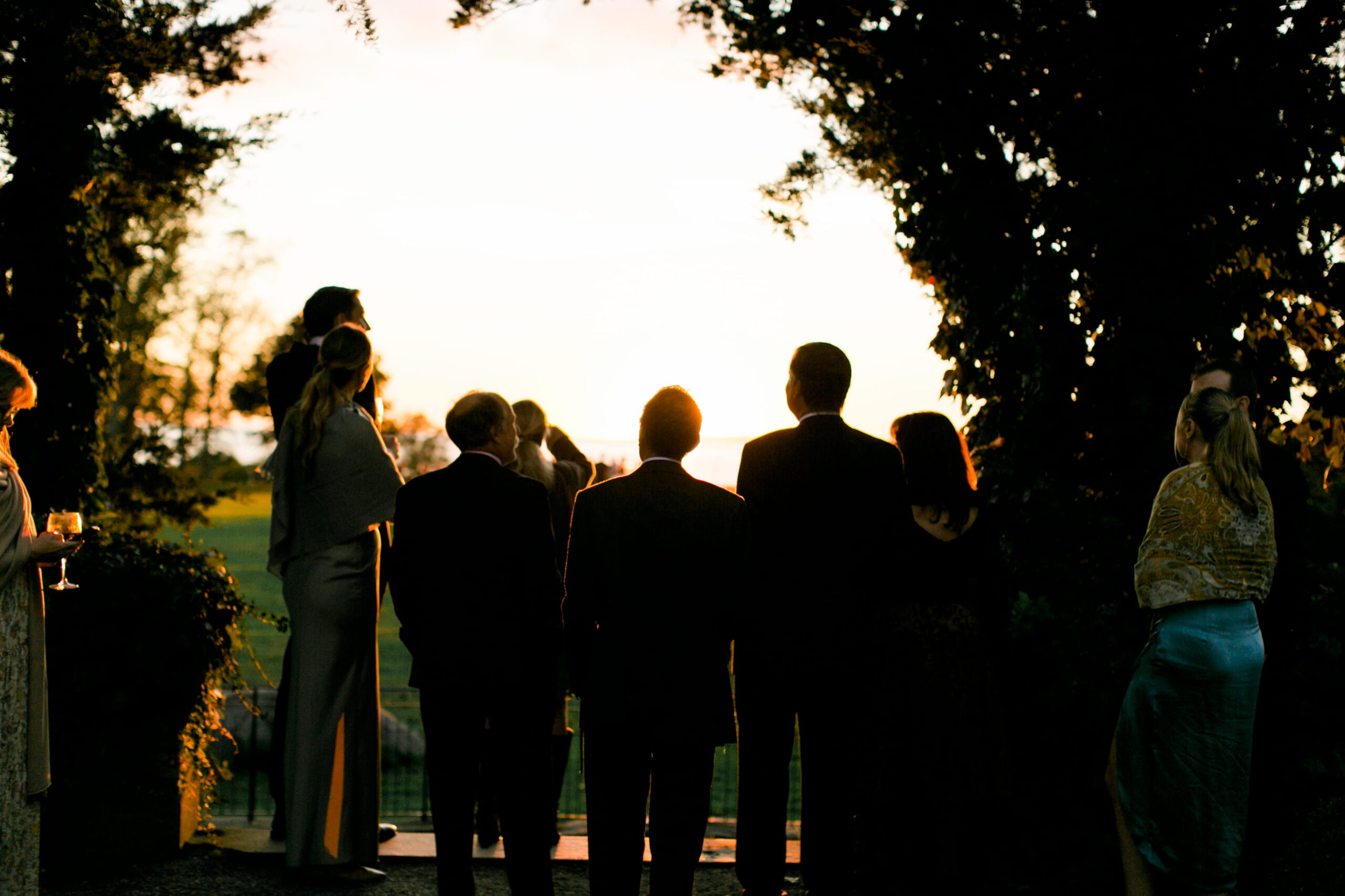 Guests mingle during wedding cocktail hour at Eolia Mansion.