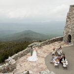 Officiant leads an intimate wedding ceremony overlooking the valley in the Adirondacks, New York.